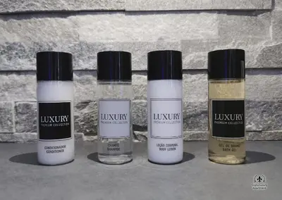 three bottles of liquids sitting next to a wall at Giglio Luxury Apartment - Romantic Jacuzzi in Rome