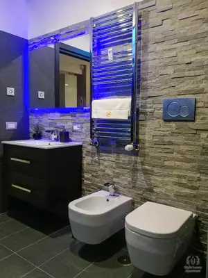 a bathroom with a toilet and a sink and a tub at Giglio Luxury Apartment - Romantic Jacuzzi in Rome