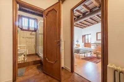a hallway with a door open to a room at GuestHost - Montecitorio & Pantheon Stylish Flat in Rome
