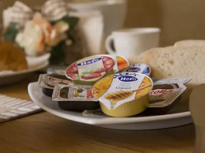 a plate with different types of food on a table at Vacanze romane holidays in Rome