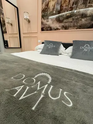 a bed with the word aids written on it at Domus Avi Vaticano in Rome