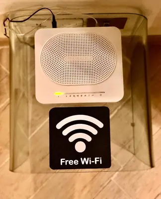 a radio with a free wifi sign on it at La Tana al Flaminio in Rome
