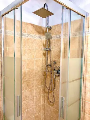 a shower with a shower head in a bathroom at La Tana al Flaminio in Rome