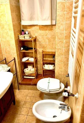 a bathroom with a toilet and a sink at La Tana al Flaminio in Rome