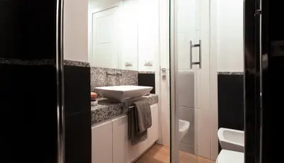 a bathroom with a sink and a toilet at Urbanflat Roma in Rome