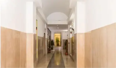 a hallway in a building with wooden walls at Urbanflat Roma in Rome