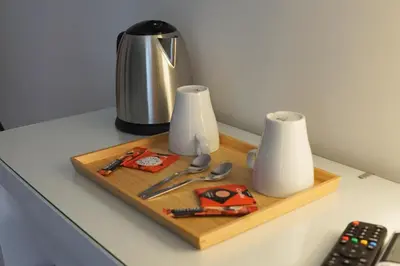 a wooden cutting board with utensils on a table at Roma Trasteverina in Rome