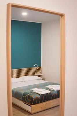 a bedroom with a bed in a frame at Roma Trasteverina in Rome