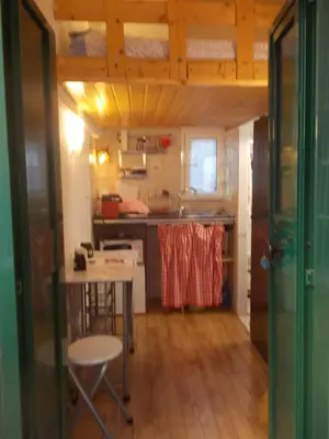 a small kitchen with a table and a sink at Il rifugio di sav. in Rome