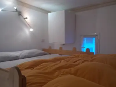 a bedroom with two beds and a window at Il rifugio di sav. in Rome