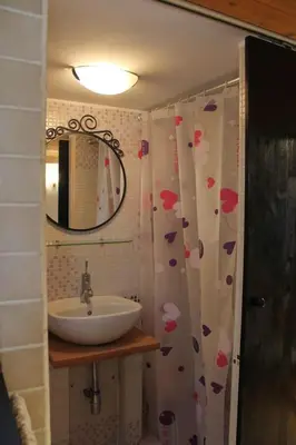 a bathroom with a sink and a mirror at Il rifugio di sav. in Rome