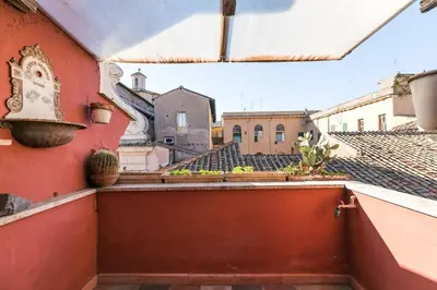 a view from the balcony of a red building at Scala Lovely Terrace Apartment in Rome