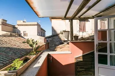 an open door to a balcony of a building at Scala Lovely Terrace Apartment in Rome