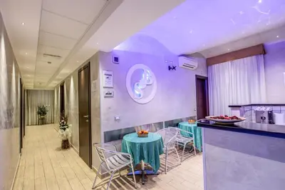 a restaurant with a table and chairs in a room at Buonarroti Suite in Rome