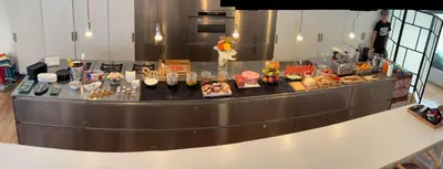 a buffet line with many different types of food at Wrooms Guest House in Rome