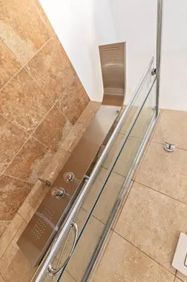 a shower with a glass door in a bathroom at Vatican Domus Luxury Rooms in Rome
