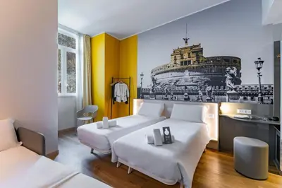 a bedroom with two beds and a black and yellow wall at B&B Hotel Roma Pietralata Tiburtina in Rome
