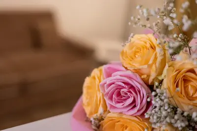 a bouquet of flowers sitting on a table at T-House Fontana di Trevi in Rome