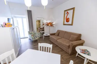 a living room with a couch and a table at T-House Fontana di Trevi in Rome