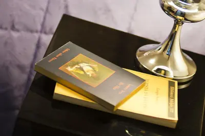 a book sitting on top of a table with a trophy at Domus Fontis in Rome