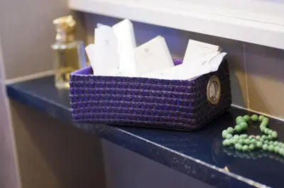 a purple basket sitting on top of a counter with a beads at Domus Fontis in Rome