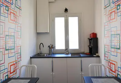 a kitchen with a sink and a window at Alloggio per uso turistico D'Ambrosio Antonella Gli Scipioni 53 in Rome