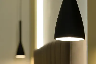 two lights hanging from a wall in a room at La dolce casa di Giulia in Rome