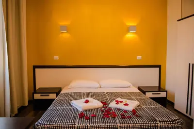 a bedroom with a bed with two towels on it at Chroma Exy - Chroma Italy in Rome