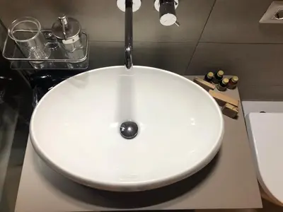 a white sink with a faucet in a bathroom at 500 Suite Prati delle Vittorie in Rome