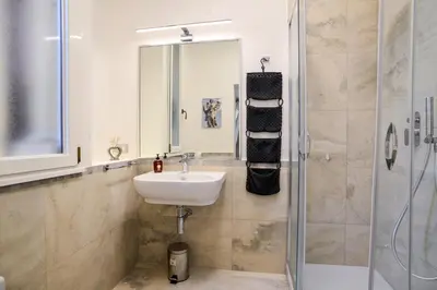 a bathroom with a sink and a shower at St. Petrus et Aurelia in Rome