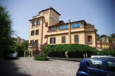 a building with a car parked in front of it at St. Petrus et Aurelia in Rome