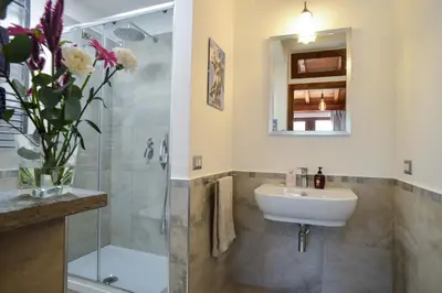 a bathroom with a sink and a shower at St. Petrus et Aurelia in Rome