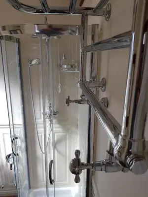 a shower in a bathroom with a mirror at Regal House Roma Navigatori 23 in Rome