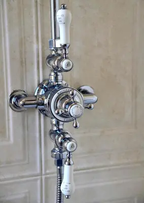a metal pipe chandelier hanging from a wall at Regal House Roma Navigatori 23 in Rome