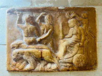 a relief on the side of a wall at Ancient Roman Mansion in Rome