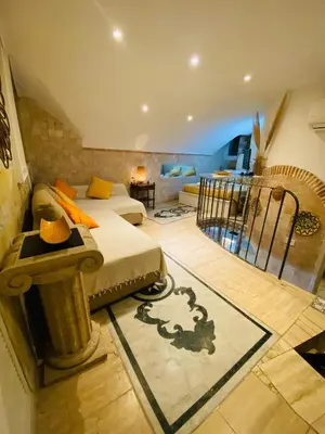 a bedroom with a bed and a living room at Ancient Roman Mansion in Rome