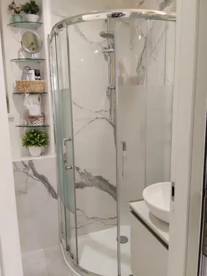 a shower with a glass door in a bathroom at La Calla al Colosseo in Rome