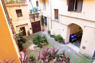 an overhead view of a courtyard in a building with plants at Sunny Home in Rome