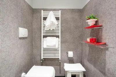 a bathroom with a white toilet and a shower at Rome in your heart - Spagna Single Room in Rome
