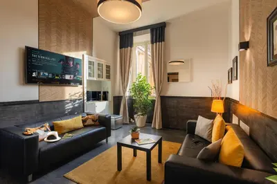 a living room with a couch and a table at Domus Liberius - Rome in Rome