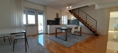 a kitchen and dining room with a table and chairs at Guesthouse Vassallo Due in Rome