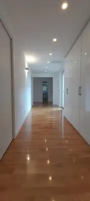 an empty hallway with wood floors and white walls at Guesthouse Vassallo Due in Rome
