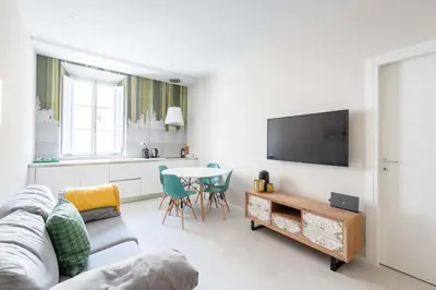 a living room with a couch and a table at SuityRHome RioneMonti54 in Rome