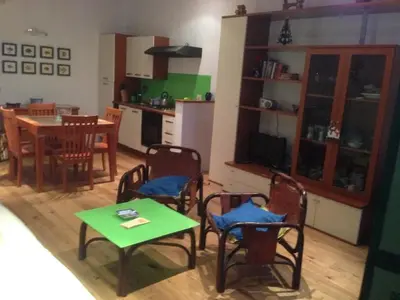 a kitchen and dining room with a table and chairs at the blu and green apartment in Rome
