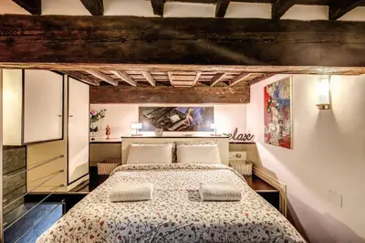 a bedroom with a large bed in a room at Spacious Flat by Piazza Navona in Rome