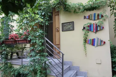 a door to a house with books on it at The Beehive Hostel in Rome