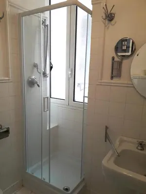 a room with a desk and a computer in it at La Casa di Silvestro in Rome