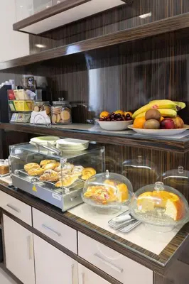a buffet with a bunch of food in a kitchen at Maison Candia Luxury House in Rome