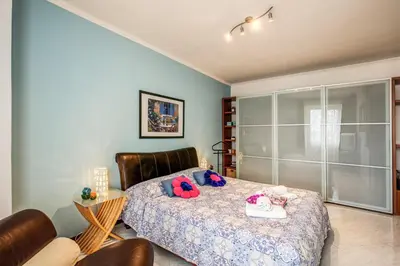 a bedroom with a bed with stuffed animals on it at Sunrise Apartment in Rome