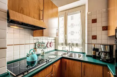 a kitchen with a teapot on a stove top oven at Sunrise Apartment in Rome